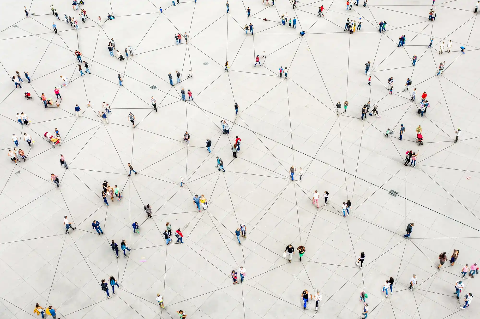 Crowd moving along a grid of lines, illustrating cooperation and interconnectedness.