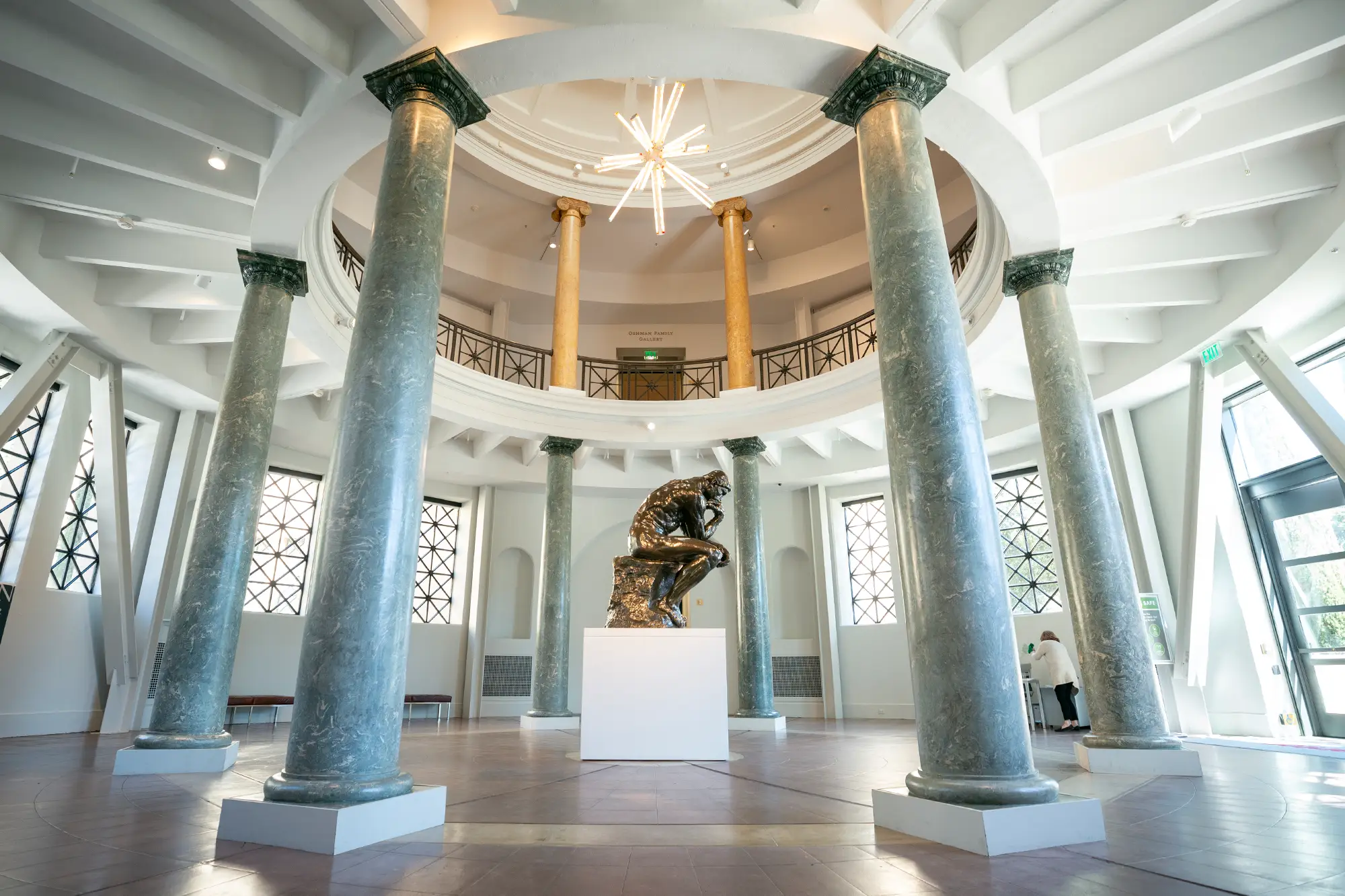 An expansive room showcasing a prominent statue as its focal point, enhancing the room's aesthetic appeal.